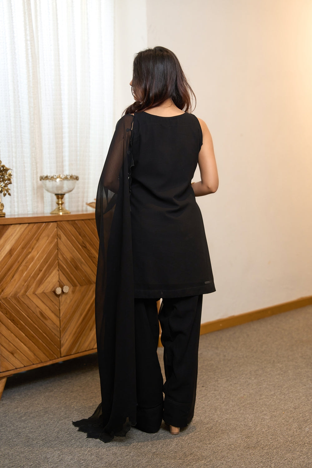 Elegant black Noir Nazaakat Kurta Set by Indianvirasat featuring intricate embroidery and matching churidar for festive occasions.