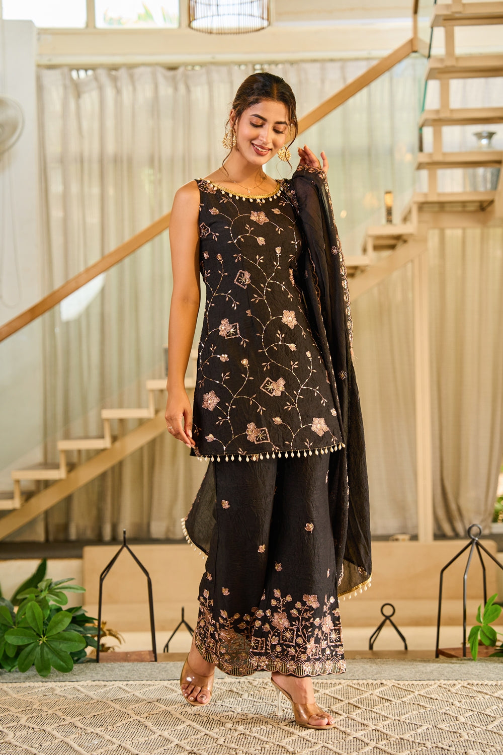 Indianvirasat Zivara Noir Heritage Kurta Set featuring intricate embroidery and traditional design, displayed on a hanger.