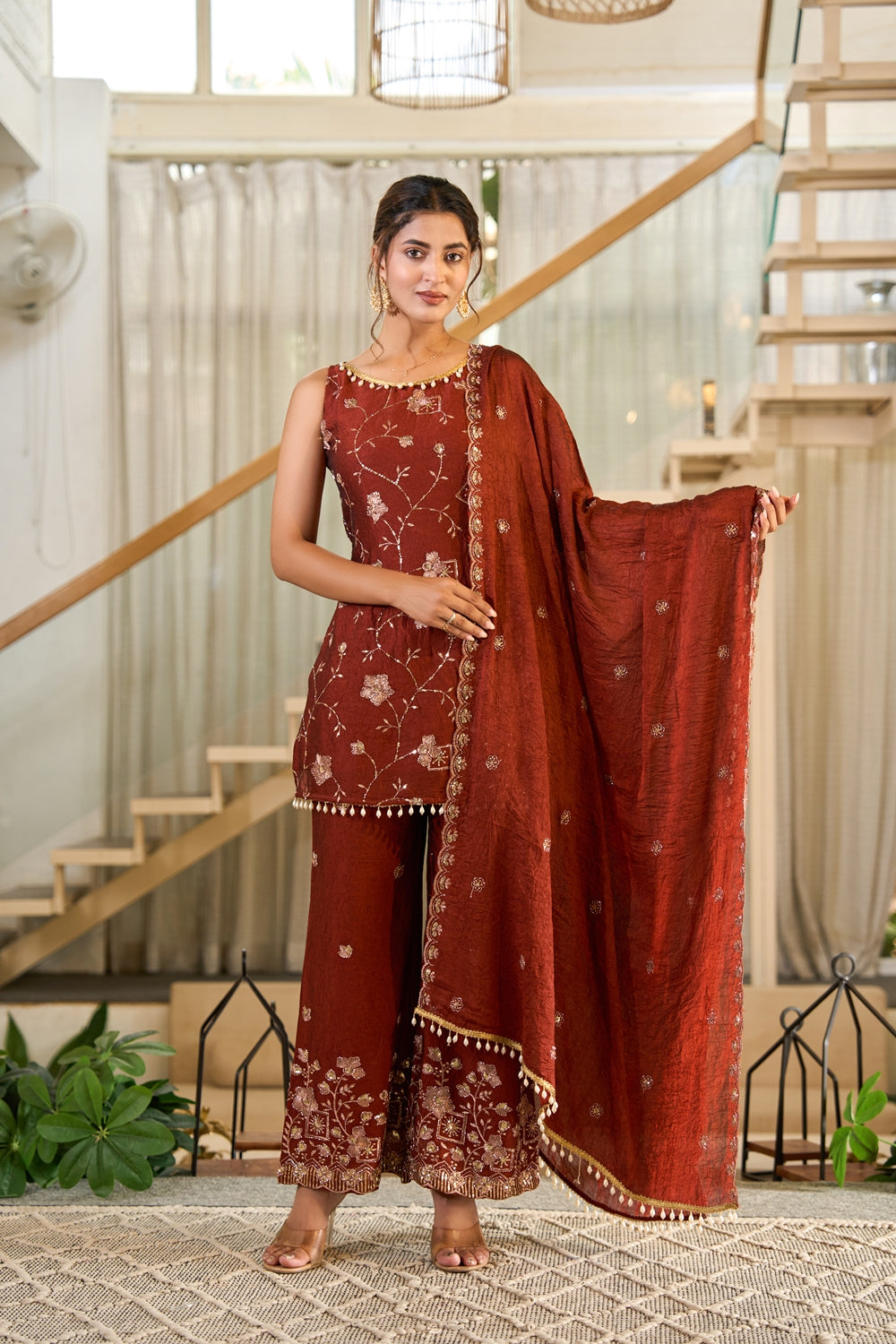 Rust embroidered Zarmina Kurta Set by Indianvirasat with intricate embroidery and traditional design, displayed on a plain background.