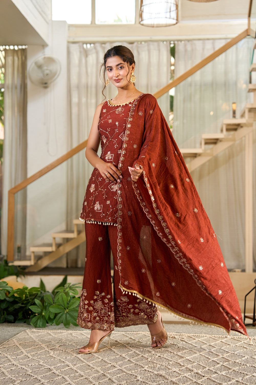 Rust embroidered Zarmina Kurta Set by Indianvirasat featuring intricate embroidery and traditional styling.