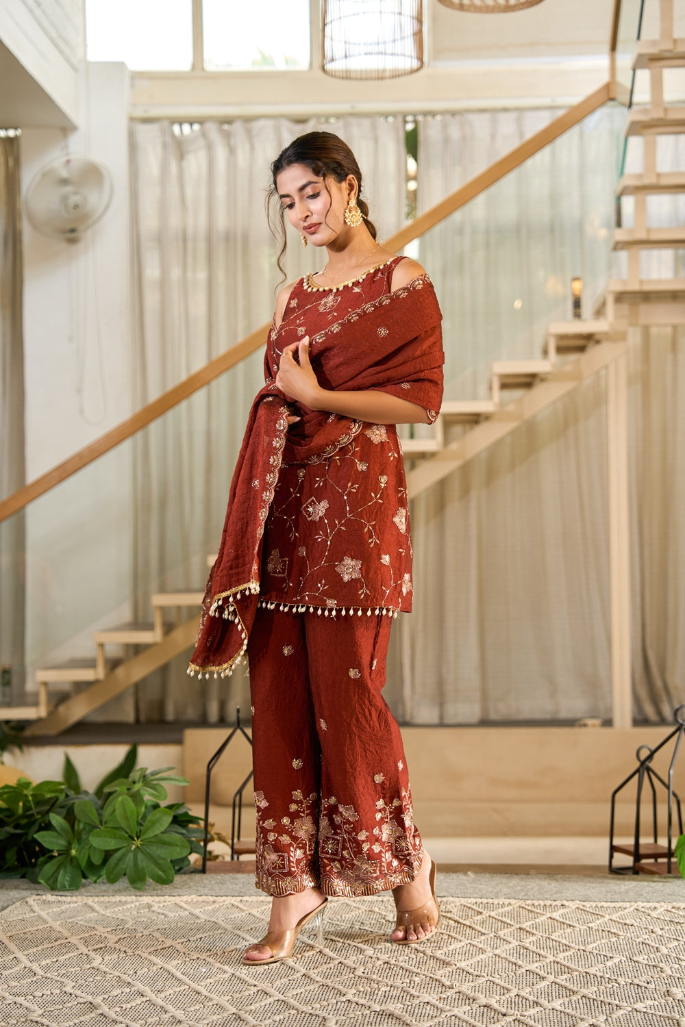 Rust embroidered Zarmina Kurta Set by Indianvirasat featuring intricate embroidery and traditional design, displayed on a mannequin.