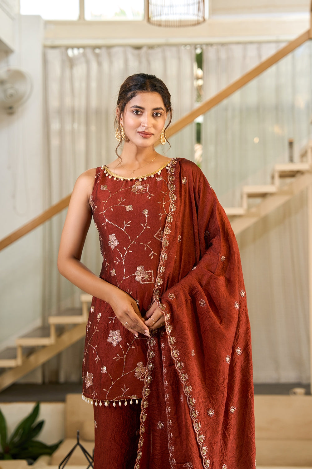 Rust-colored Zarmina embroidered kurta set with intricate rust embroidery, featuring traditional Indian design by Indianvirasat.