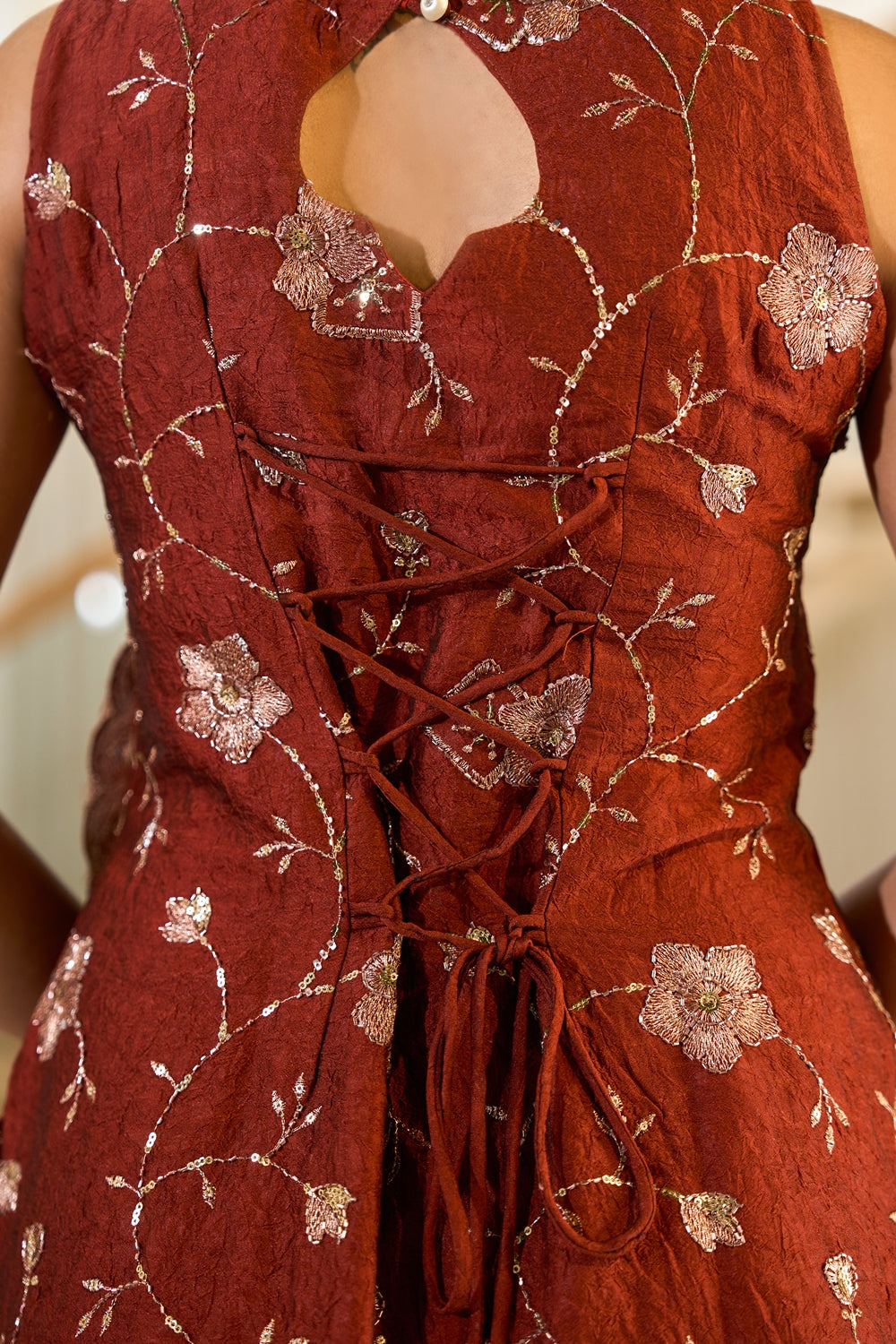 Rust-colored Zarmina embroidered kurta set with intricate embroidery, paired with matching pants, by Indianvirasat.