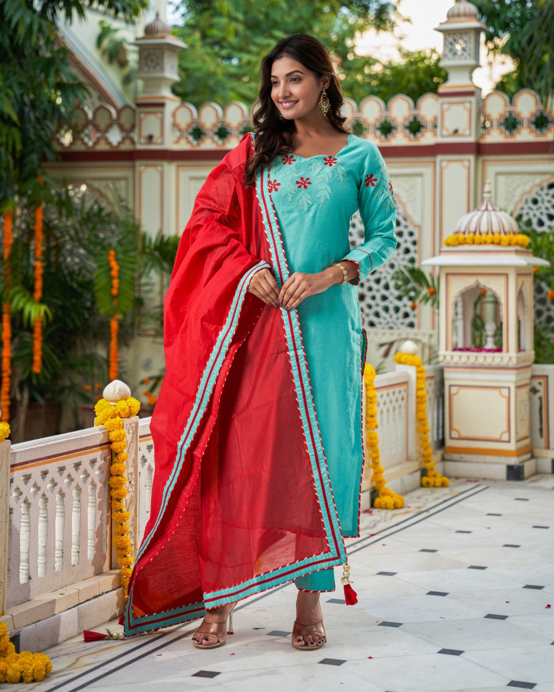 Indianvirasat Aqua Meher Kurta Set with intricate embroidery, featuring a long kurta and matching bottoms on a hanger.