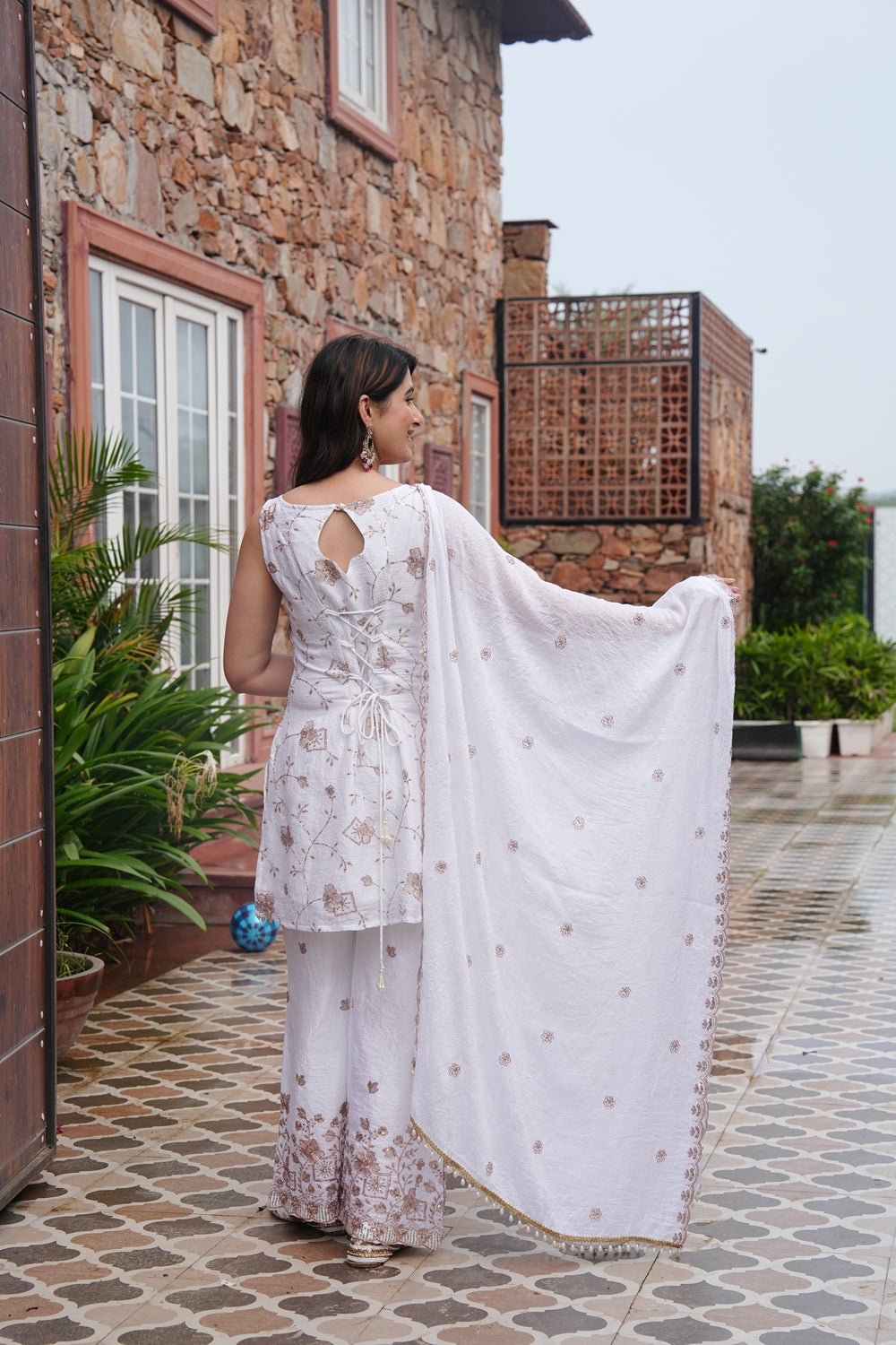 White wedding wear kurta set by Indianvirasat featuring intricate embroidery, perfect for traditional bridal or festive occasions.