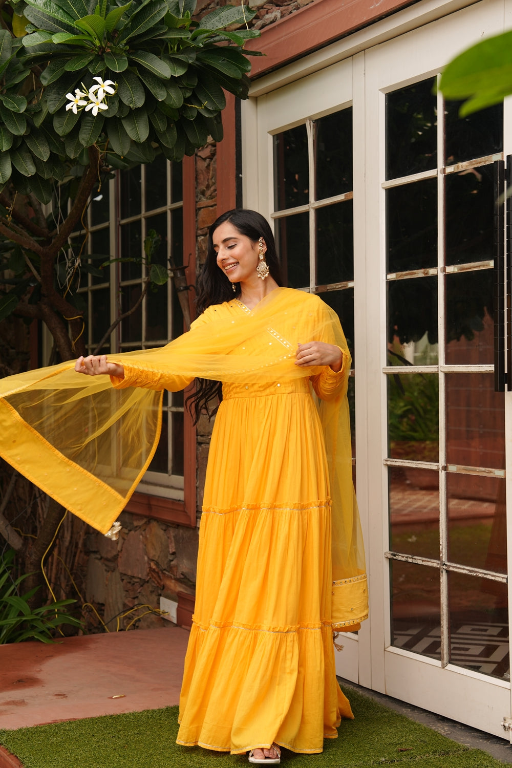Yellow cotton ethnic dress by Indian Virasat featuring traditional design, perfect for festive or casual occasions.