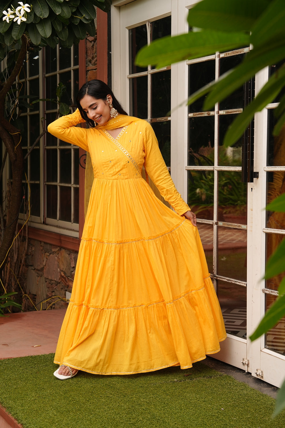 Yellow cotton ethnic dress by Indian Virasat featuring traditional design and vibrant fabric, perfect for cultural occasions.